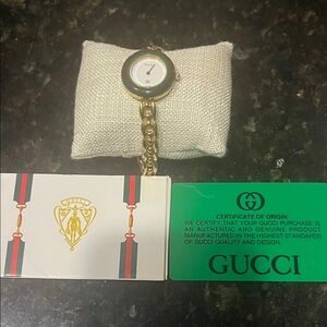 Gucci Women's Gold Watch with Green Accent